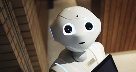 Image of a chatbot robot smiling 